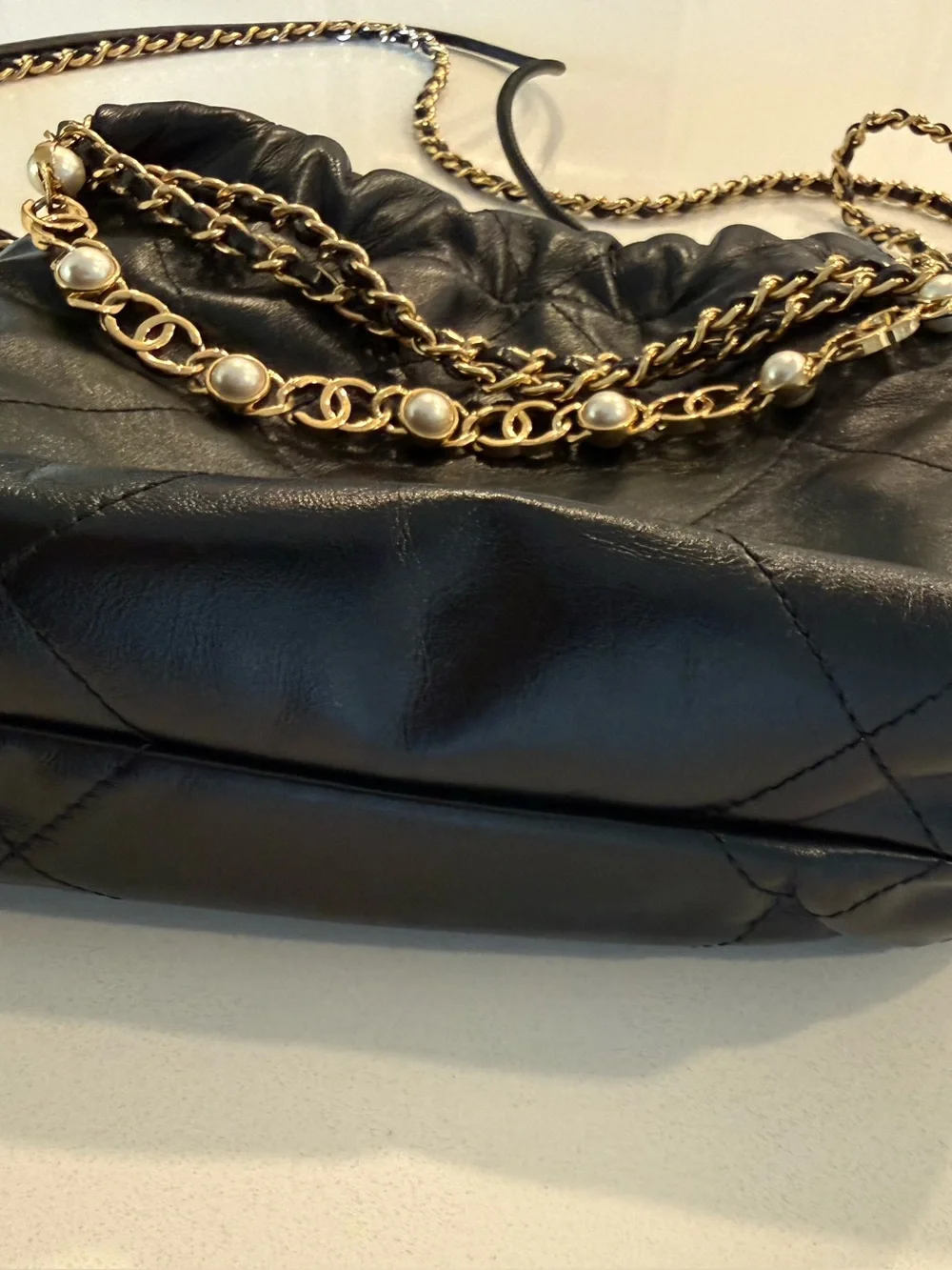 CHANEL 22 Black Quilted Leather Crossbody with Pearl-Trim Chain